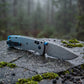 Damascus Folding Pocket Knife - Lightweight TC4 Handle, Drop Point Steel Blade, Dual Thumb Stud, Crossbar Lock, Deep Carry Clip