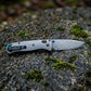Damascus Folding Pocket Knife - Lightweight TC4 Handle, Drop Point Steel Blade, Dual Thumb Stud, Crossbar Lock, Deep Carry Clip